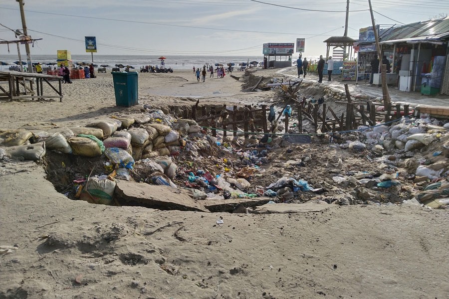 Photo shows the eroded road at Kolatali beach point in Cox's Bazar district