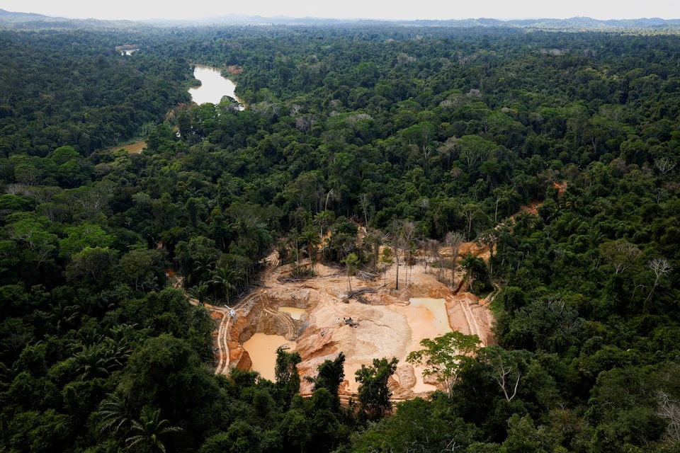 A helicopter of the Brazilian Environmental Agency (IBAMA) is seen near Uraricoera river during an operation at illegal mining in the Yanomami indigenous land, Roraima state, Brazil, February 11, 2023.