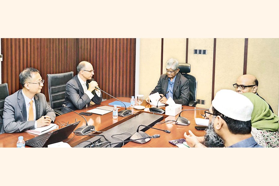 Finance Adviser Dr Salehuddin Ahmed in a meeting with a delegation of International Monetary Fund (IMF) at the Ministry of Finance in the city on Tuesday —PID photo