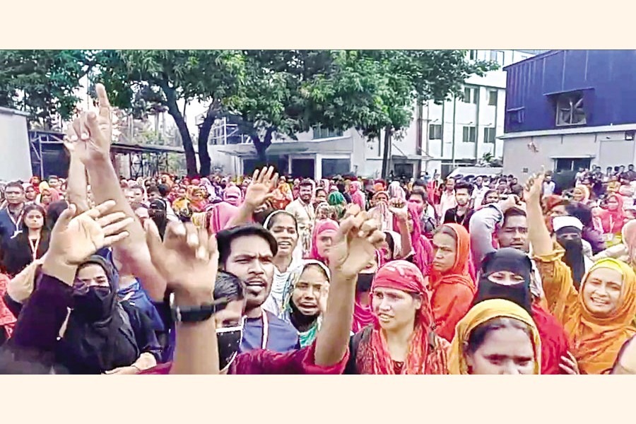 Apparel workers stage a demonstration outside Pearl Garments Company Ltd at Savar, on the outskirts of Dhaka, on Wednesday, Sept 04, 2024