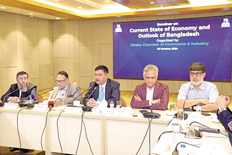 Ashraf Ahmed, president of DCCI, speaks at a seminer titled "Current State of the Economy and Outlook of Bangladesh" at the DCCI auditorium in the city on Saturday