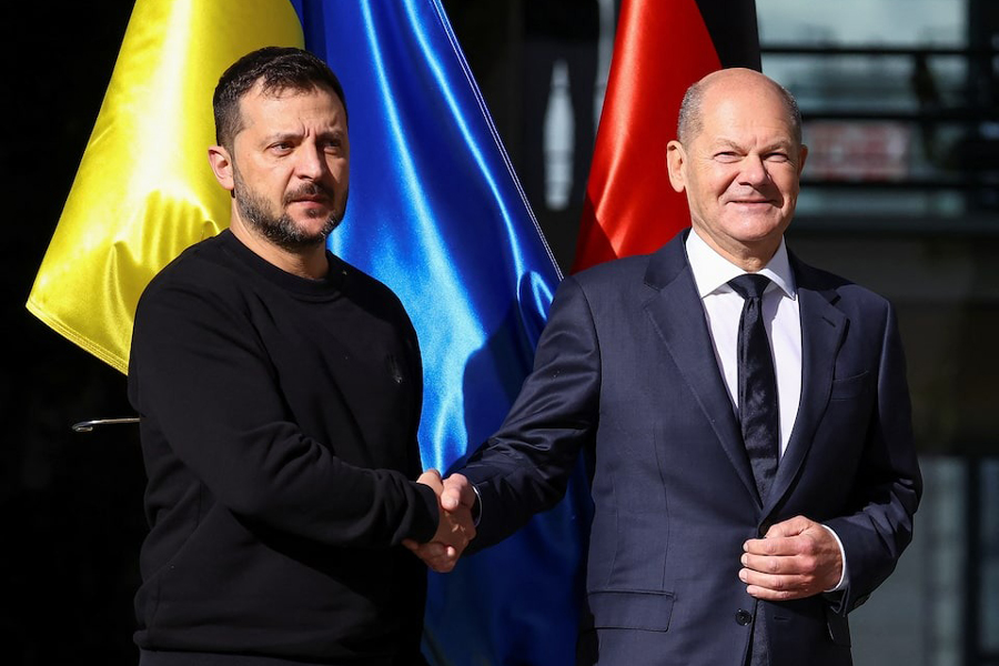 Ukrainian President Volodymyr Zelenskiy and German Chancellor Olaf Scholz shake hands as they meet in Berlin, Germany October 11, 2024.