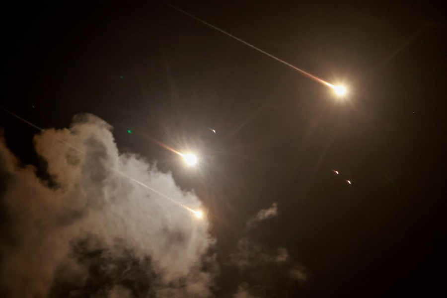 Projectiles are seen in the sky after Iran fired a salvo of ballistic missiles, amid cross-border hostilities between Hezbollah and Israel, as seen from Tel Aviv, Israel, October 1, 2024.