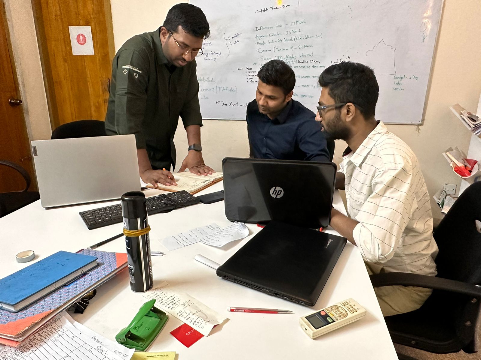 (From left) CTO of Checkbox SM Mohiuddin Milton (standing), CEO Mashfik Sarker Protik, and COO Kuntal Saha