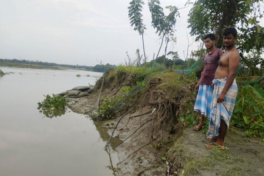 A vast area of land devoured by the Dakatia River , a tributary of the mighty river Meghna, in Roghunathpur village on the edge of Chandpur town