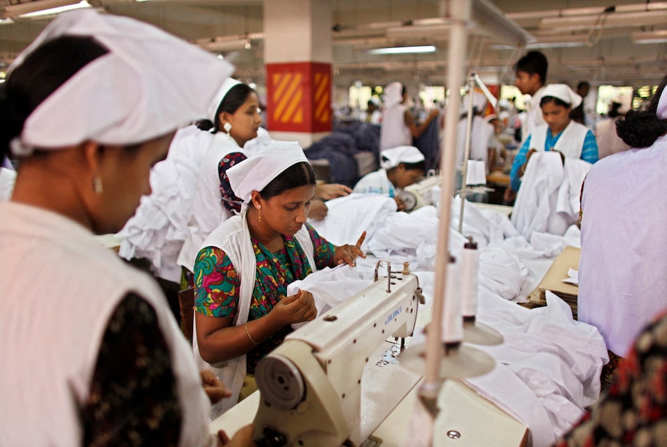 Women work at a garment factory in Gazipur May 11, 2010. REUTERS/Andrew Biraj/File Photo