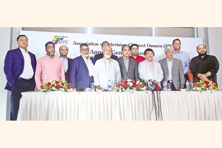 Newly-elected directors of the Association of Television Channel Owners pose for a photo at a city hotel on Wednesday