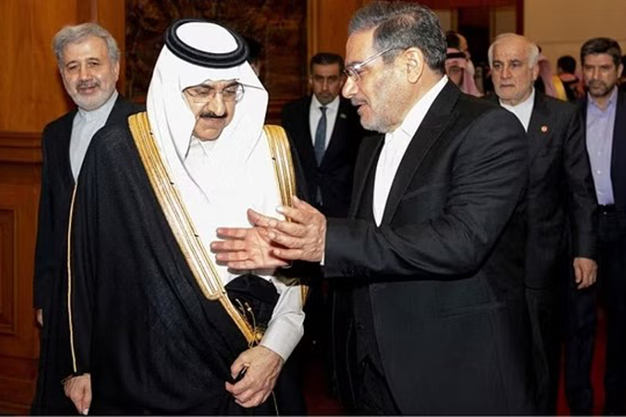 FILE PHOTO: Secretary of Iran's Supreme National Security Council Ali Shamkhani talks with Minister of State and national security adviser of Saudi Arabia Musaad bin Mohammed Al Aiban during a meeting in Beijing, China, Mar 10, 2023. cnsphoto via REUTERS