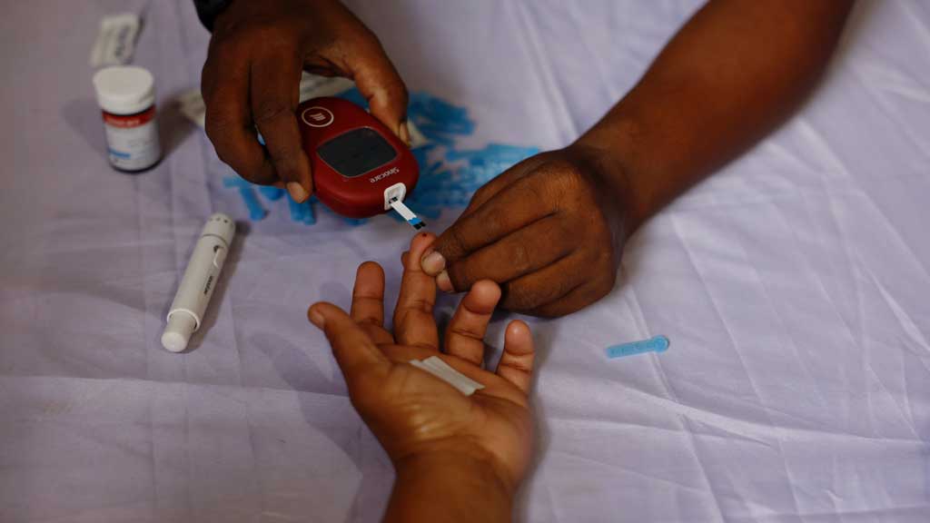 A person receives a free blood sugar test during a campaign to mark the World Diabetes Day in Dhaka, Bangladesh, November 14, 2024. REUTERS
