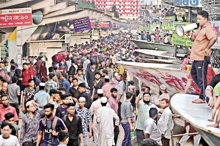 People in their large numbers gathered at the Sadarghat launch terminal in Dhaka on Wednesday to leave the capital via waterways to celebrate Eid-ul Fitr with their near and dear ones — FE photo by KAZ Sumon