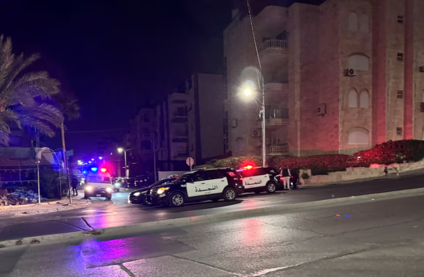 Police vehicles on a street near the Israeli embassy in Amman, Jordan November 24, 2024. REUTERS/Jehad Shelbak