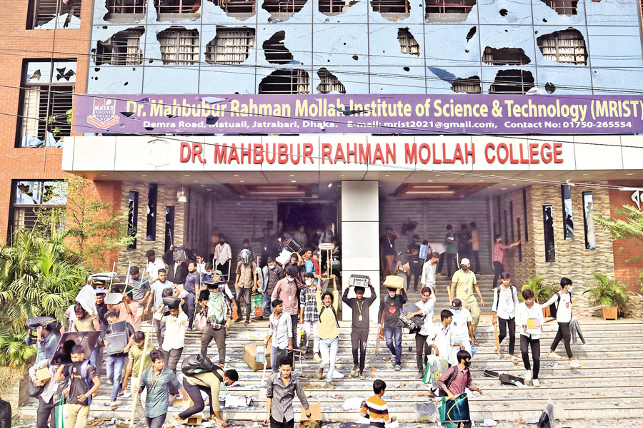 Students of Shaheed Suhrawardy College and Kabi Nazrul College ransacked Dr Mahbubur Rahman Mollah College and looted valuables in the capital's Demra area on Monday. — FE Photo by Shafiqul Alam