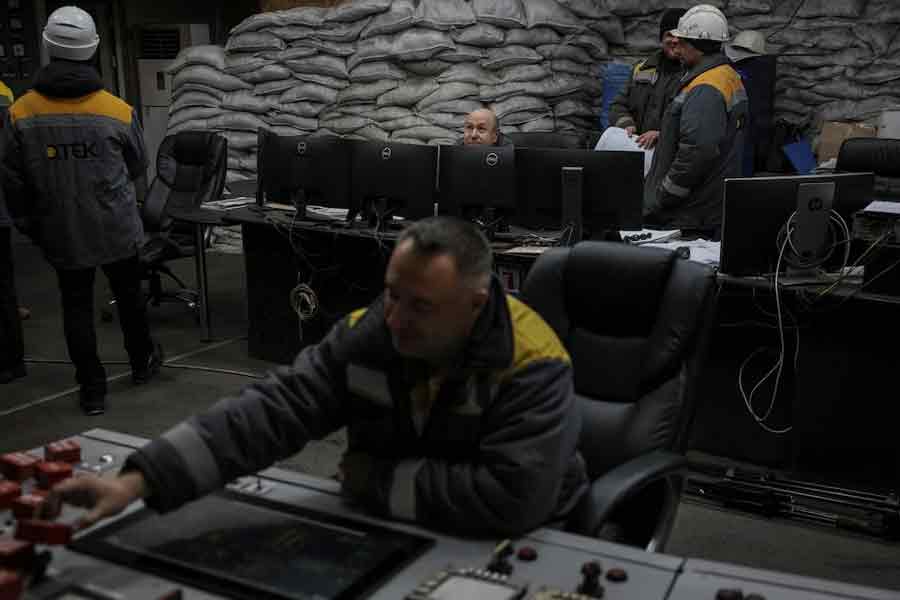 Employees work in a control centre of the thermal power plant damaged by Russian missile strike, amid Russia’s attack on Ukraine, in an undisclosed location of Ukraine November 28, 2024.