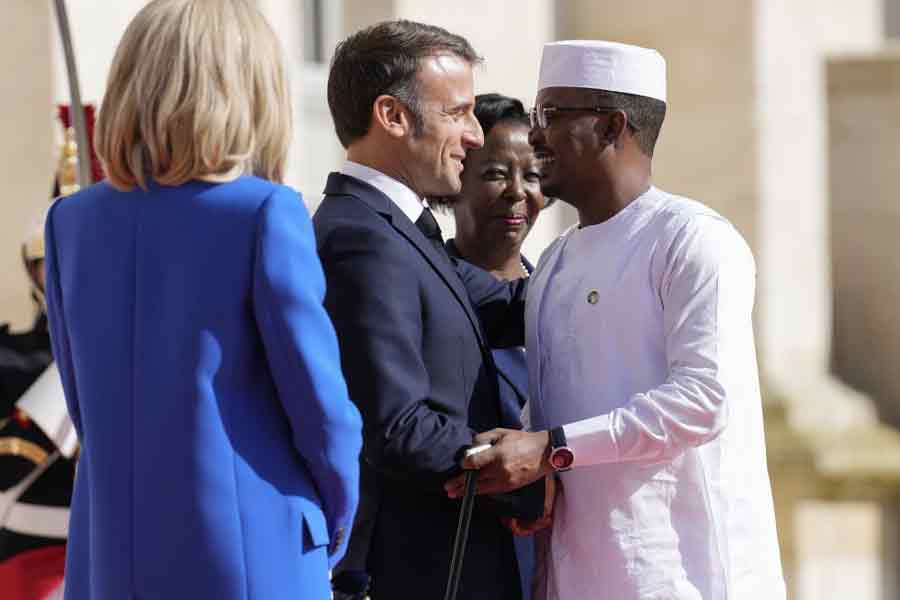 France’s President Emmanuel Macron, left, and Secretary General of the Organisation Internationale de la Francophonie Louise Mushikiwabo, center, welcome Chad’s President General Mahamat Idriss Deby Itno for the 19th Francophonie summit in Villers-Cotterets, France, Oct 4, 2024.