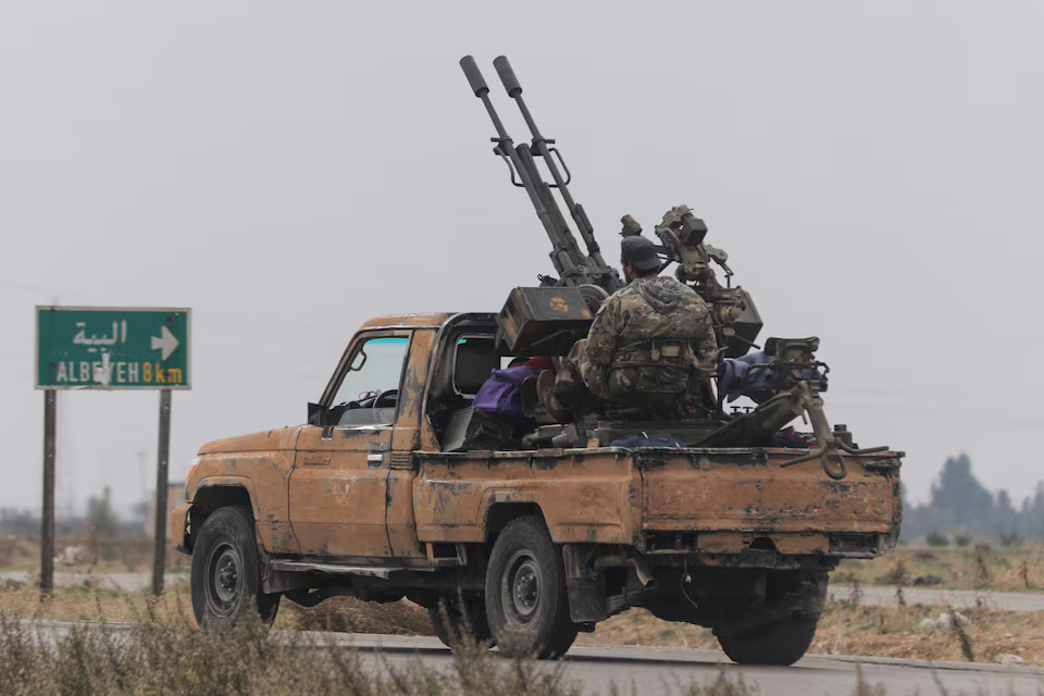 A rebel fighter sits on the back of a vehicle in Homs countryside, after Syrian rebels pressed their lightning advance on Saturday, saying they had seized most of the south, as government forces dug in to defend the key central city of Homs to try to save President Bashar al-Assad's 24-year rule, in Syria on December 7, 2024 — Reuters photo