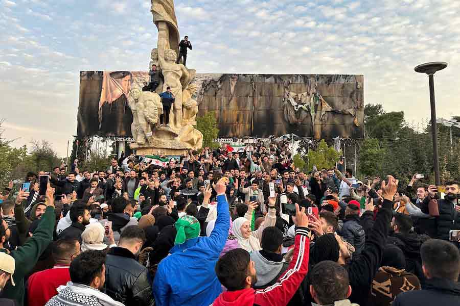 People celebrating the end of 50-year family dynasty through the ouster of President Bashar al-Assad at Saadallah al-Jabiri Square in Aleppo on Sunday –Reuters photo
