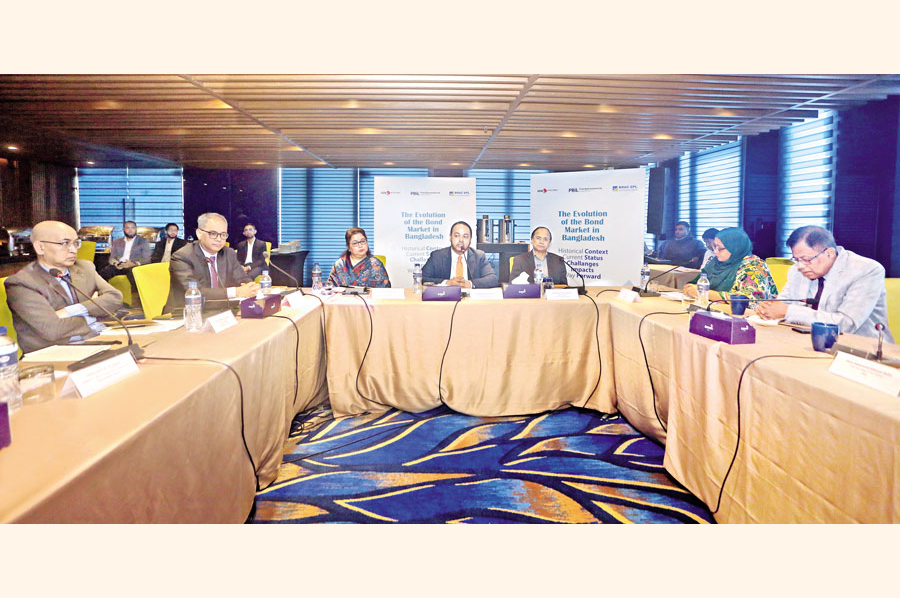 Syed Rashed Hussain, Chief Executive Officer, BRAC EPL, moderates a roundtable discussion titled 'The Evolution of The Bond Market in Bangladesh: Historical Context, Current Status, Challenges, Impacts and Way Forward' held at a city hotel on Tuesday. Shamsul Huq Zahid, Editor of The Financial Express (FE), is on his left and Farzana Lalarukh, Commissioner, BSEC, on his right. The FE and consulting firm WatermarkInc jointly organised the programme. — FE Photo.