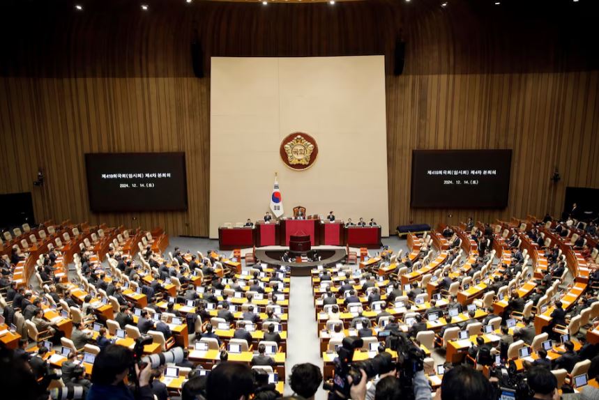 South Korean lawmakers during a plenary session of the impeachment vote of President Yoon Suk Yeol at the National Assembly in Seoul, South Korea, on Saturday, Dec.14, 2024. Woohae Cho/Pool via REUTERS Purchase Licensing Rights