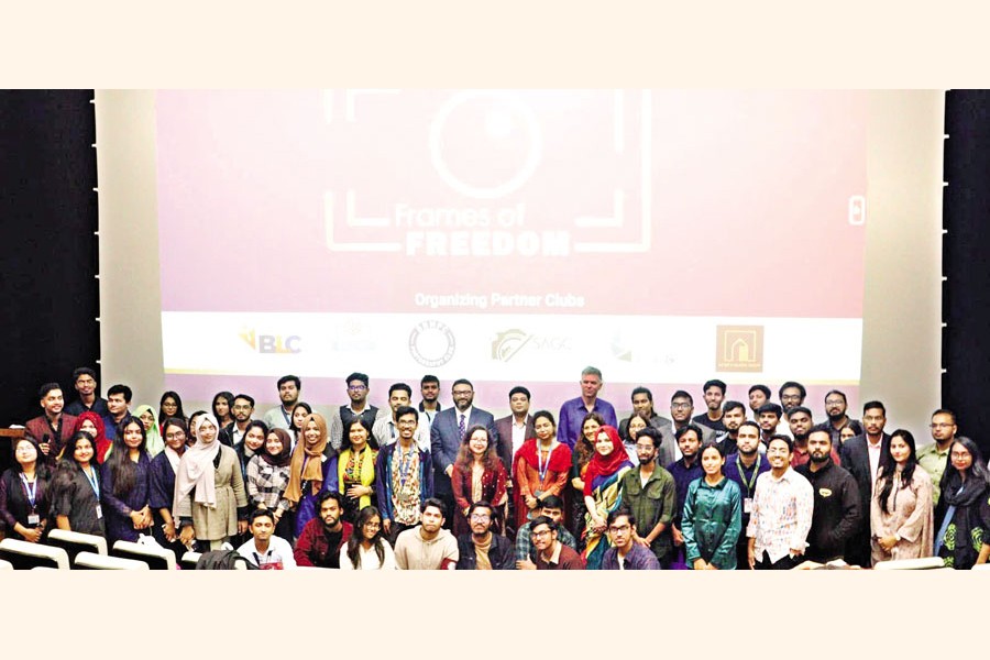 Winners, participants, and organisers gather on stage to celebrate the success of ‘Frames of Freedom’, a photogrphay exhibition held at BRAC University in Dhaka recently