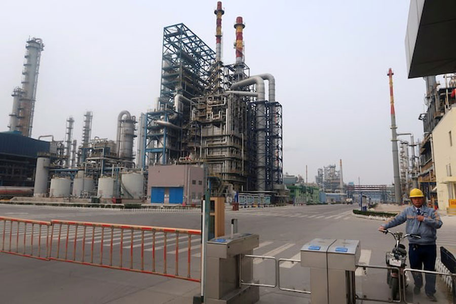 A man is seen at an exit of the refinery plants of Chambroad Petrochemicals in Binzhou, Shandong province, China October 24, 2019. Picture taken October 24, 2019.