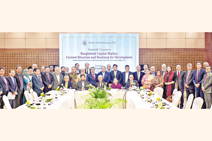 Finance Adviser Dr. Salehuddin Ahmed sits with market stakeholders at the Dhaka Stock Exchange on Tuesday to discuss ways to develop the secondary market. — Collected