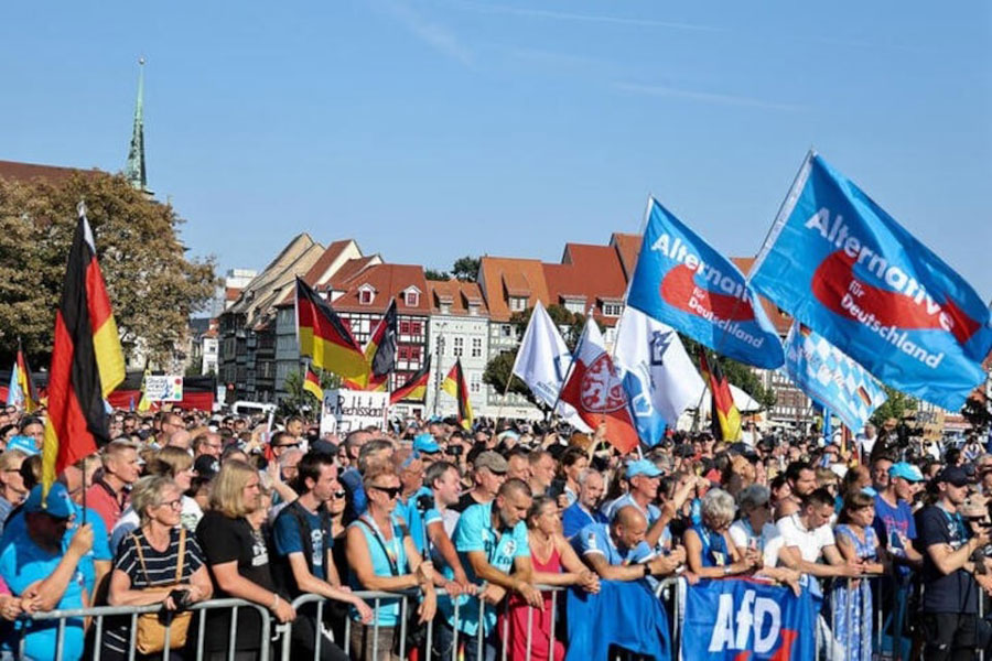 People gather at an election campaign rally of Alternative for Germany (AfD) party ahead of the Thuringia state elections, in Erfurt, Germany August 31, 2024.
