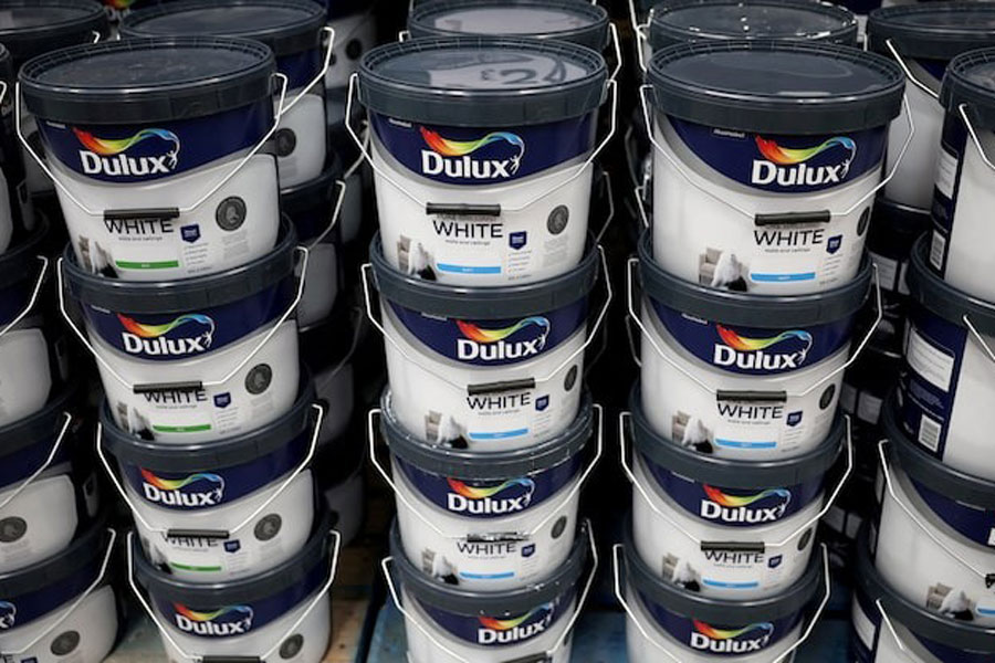 Cans of Dulux paint, an AkzoNobel brand, are seen on the shelf of a DIY retail store in Manchester, Britain, June 14, 2024.