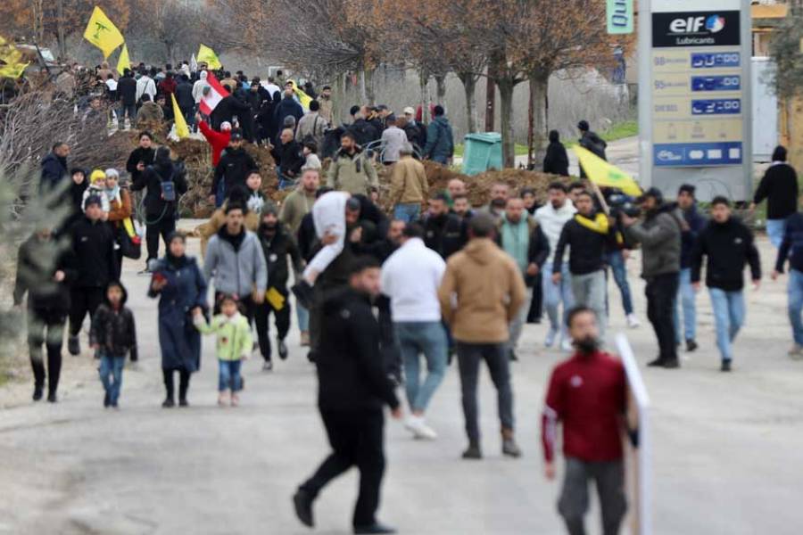 Locals gather with flags in Burj al-Muluk, near the southern Lebanese village of Kfar Kila, where Israeli forces remained on the ground after a deadline for their withdrawal passed as residents sought to return to homes in the border area, Lebanon Jan 26, 2025.