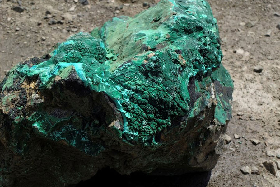 A piece of malachite, a copper ore, is seen at the bottom of Congolese state mining company Gecamines’ Kamfundwa open pit copper mine January 31, 2013.