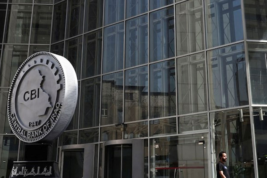 An Iraqi man walks at the headquarters of the Central Bank of Iraq in Baghdad, Iraq August 15, 2023.