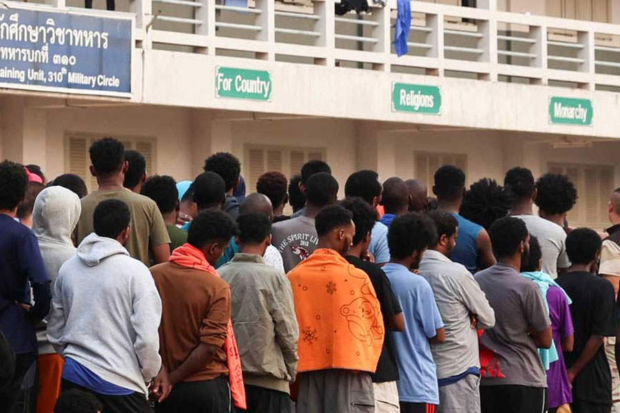 Multinational victims of scam centres, who were trafficked into working in Myanmar and were sent to Thailand on Feb 12 amid a mounting crackdown on scam centres operating along a porous border, queue to get food at a shelter inside the 310th Military District (Fort Wachiraprakan), as they wait for their embassies to pick them up, in Tak province, Thailand Feb 19, 2025.