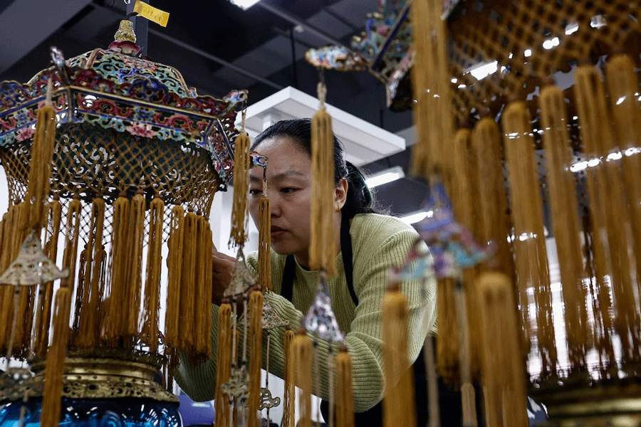 A conservator restores a cultural relic at the cultural protection and restoration department of the Palace Museum at the Forbidden City, during an organised media tour, in Beijing, China February 21, 2025.