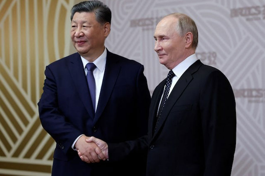 Russian President Vladimir Putin greets Chinese President Xi Jinping during a welcoming ceremony for participants of the BRICS Summit in Kazan, Russia October 22, 2024.