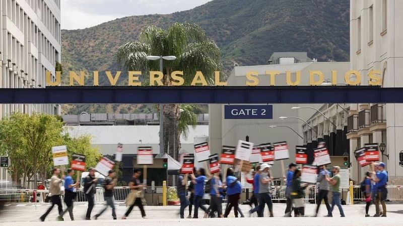 Workers and supporters of the Writers Guild of America protest outside Universal Studios Hollywood after union negotiators called a strike for film and television writers, in the Universal City area of Los Angeles, California, US, May 3, 2023. REUTERS