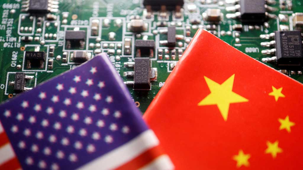Flags of China and the US are displayed on a printed circuit board with semiconductor chips, in this illustration picture taken February 17, 2023. REUTERS/Florence Lo/Illustration