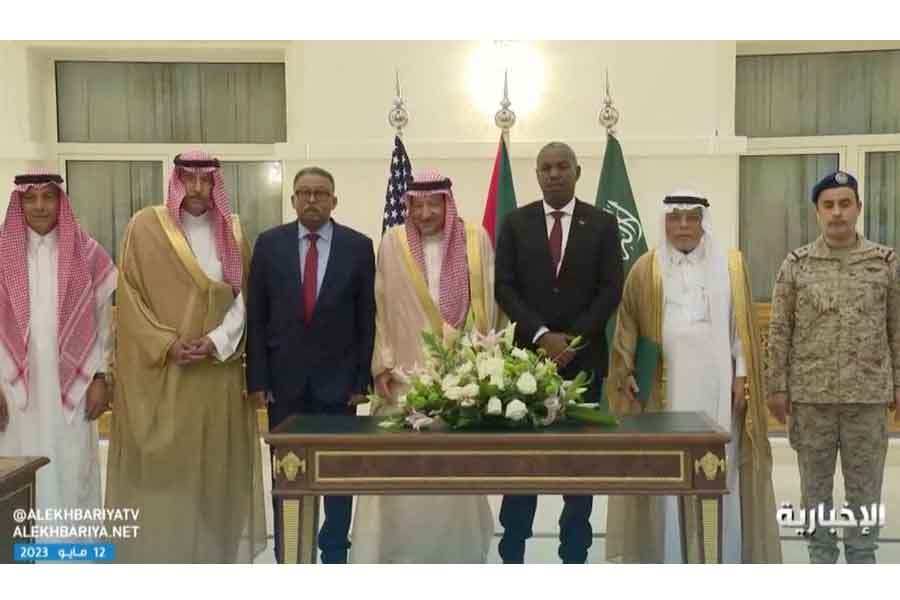 Officials standing for pictures after Sudan’s army and rival paramilitary rapid support force signed a declaration, that signifies their commitment to protect the civilians of Sudan but not to a ceasefire, in Jeddah of Saudi Arabia on Thursday -Reuters file photo