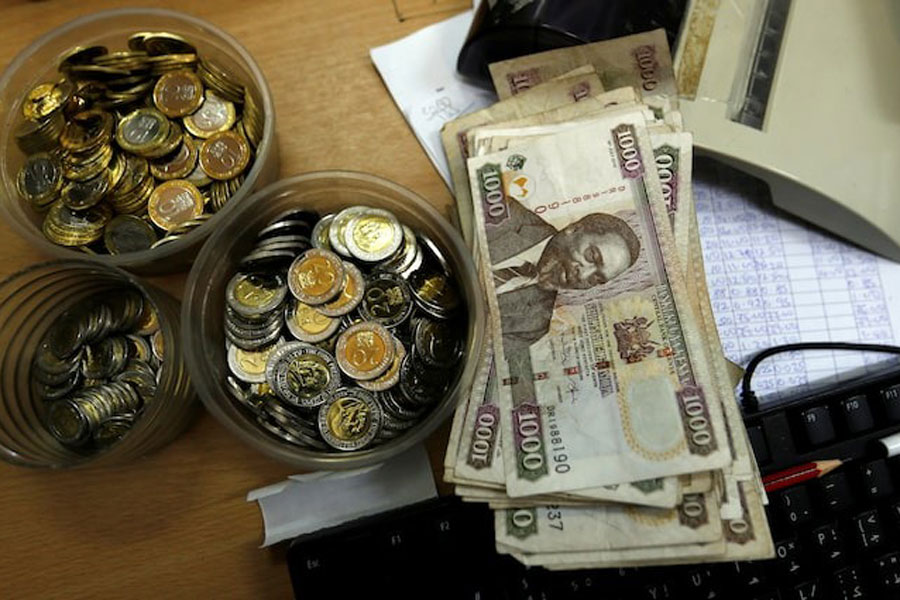 Kenya shilling coins and notes are pictured inside a cashier's booth at a forex exchange bureau in Kenya's capital Nairobi, April 20, 2016.