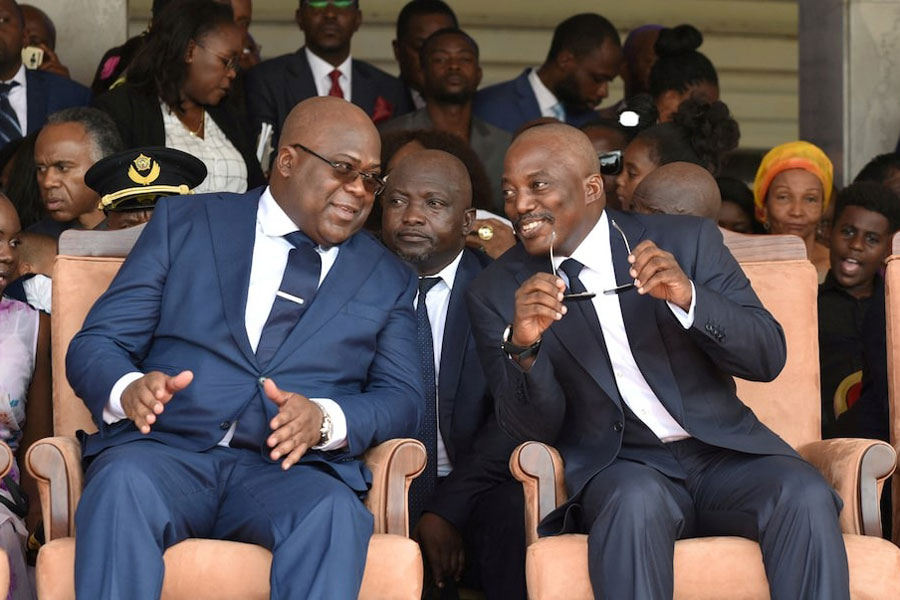 Democratic Republic of Congo's outgoing President Joseph Kabila sits next to his successor Felix Tshisekedi during an inauguration ceremony whereby Tshisekedi will be sworn into office as the new president of the Democratic Republic of Congo at the Palais de la Nation in Kinshasa, Democratic Republic of Congo January 24, 2019.