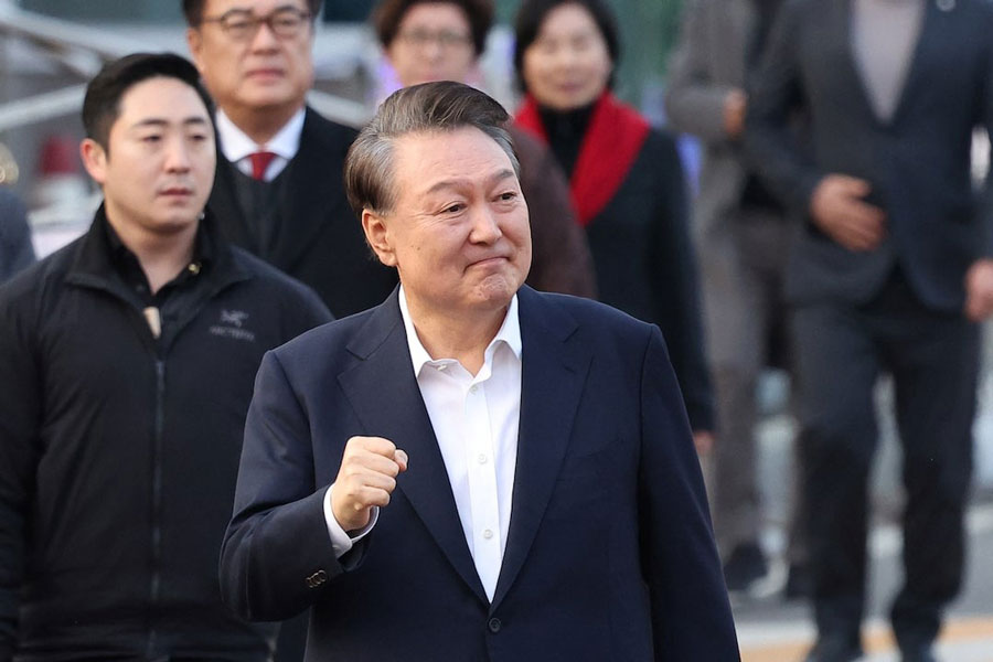 South Korean impeached President Yoon Suk Yeol gestures outside the Seoul detention center after his release, in Uiwang, South Korea, March 8, 2025.