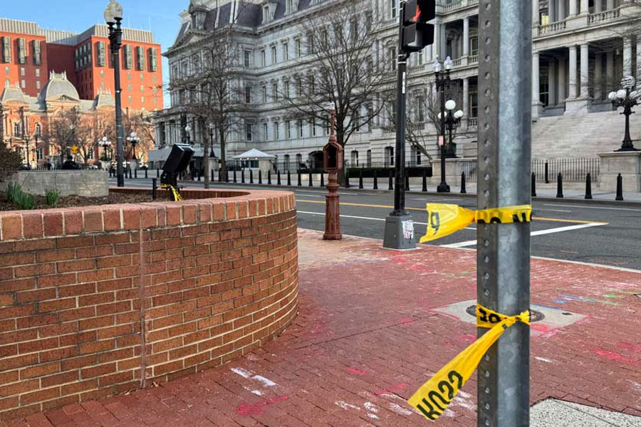 Police tape remains at the scene of an overnight shooting on a street bordering the White House complex, after Secret Service say they shot a man brandishing a firearm in Washington, DC, US Mar 9, 2025.