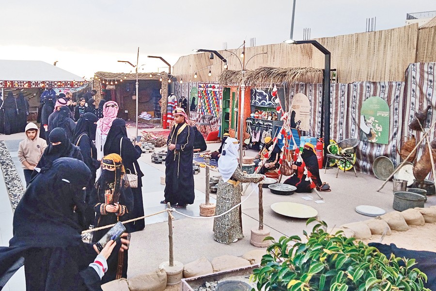 Saudi Arabian people gather at a place in the city of Taif to celebrate the founding day