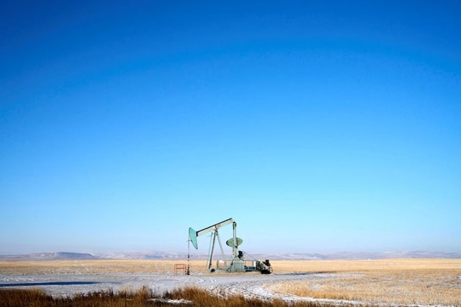 A view of an oil pump jack on the prairies near Claresholm, Alberta, Canada January 18, 2025.