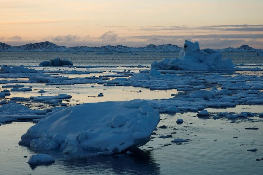 Ice floats as the sun sets in Nuuk, Greenland, February 10, 2025.