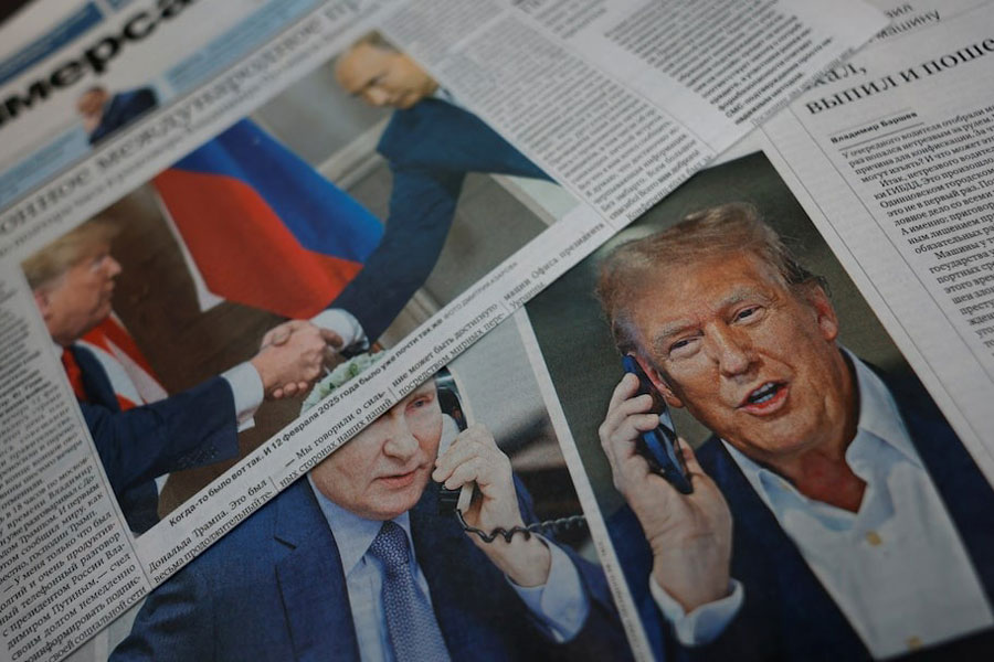 Daily newspapers with covers, dedicated to the recent phone call of Russian President Vladimir Putin and US President Donald Trump, are laid out at a newsstand in a street in Moscow, Russia, February 13, 2025.