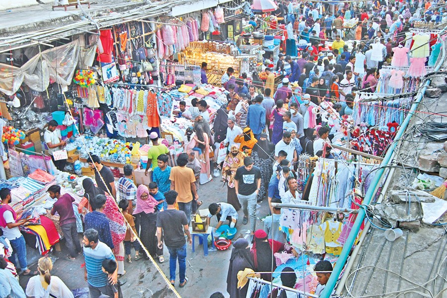 A number of city dwellers thronged New Market and its surrounding markets in the capital on Friday for their last-moment Eid shopping, as the Eid-ul-Fitr is knocking at the door — Focus Bangla