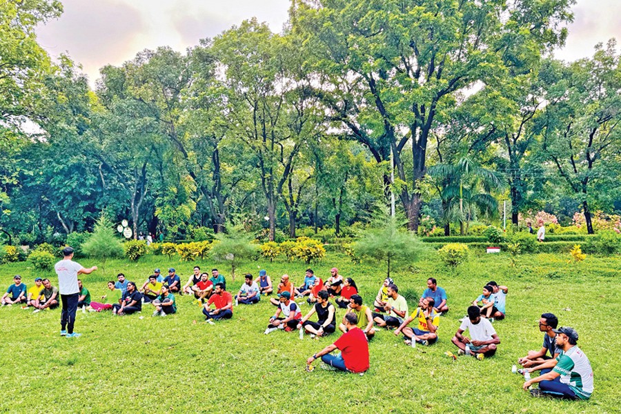 The writer is taking a fitness and wellness session at National Botanical Garden in Dhaka