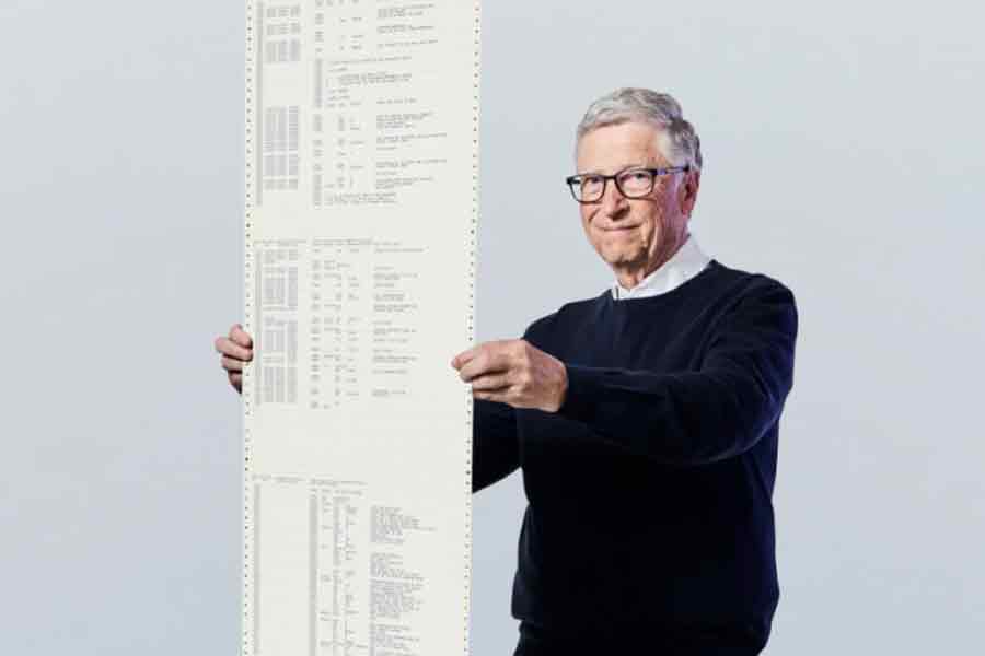 This recent photo provided by Gates Ventures shows Microsoft founder Bill Gates holding a printout of the computer coding that launched the software maker in April 1975.