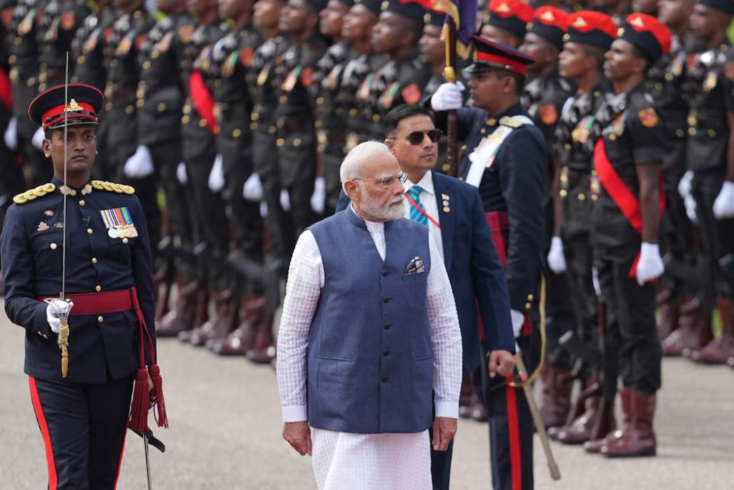 India's Prime Minister Narendra Modi inspects an honour guard during his welcoming ceremony at Independence square in Colombo, Sri Lanka, April 5, 2025. REUTERS/Thilina Kaluthotage