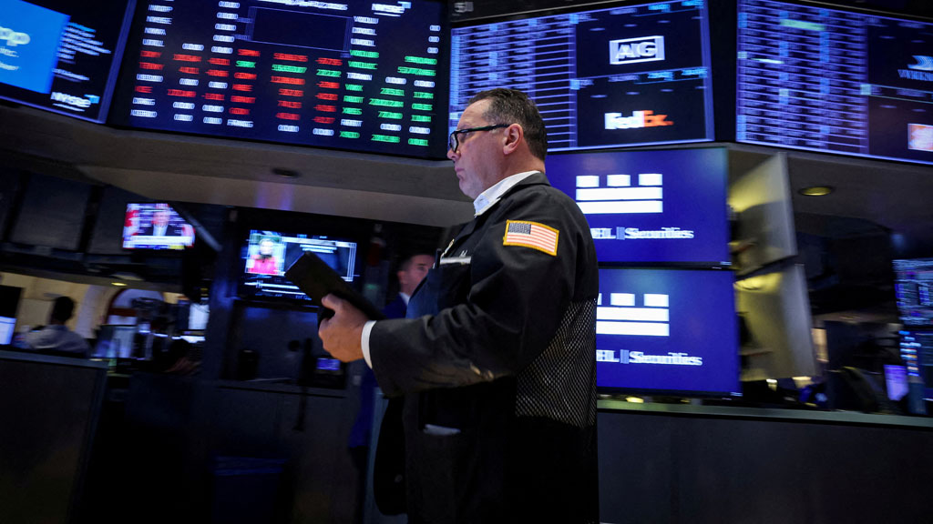 FILE PHOTO: A trader works on the floor at the New York Stock Exchange (NYSE) in New York City, US, Apr 2, 2025. REUTERS/Brendan McDermid/File Photo