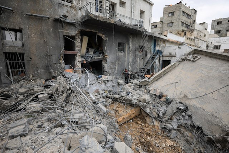 Palestinians inspect the damage after two Israeli missiles hit a building inside the Al-Ahli Arab Baptist Hospital, shortly after patients were evacuated following a call from someone who identified himself with Israeli security, in Gaza City on April 13, 2025 — Reuters photo